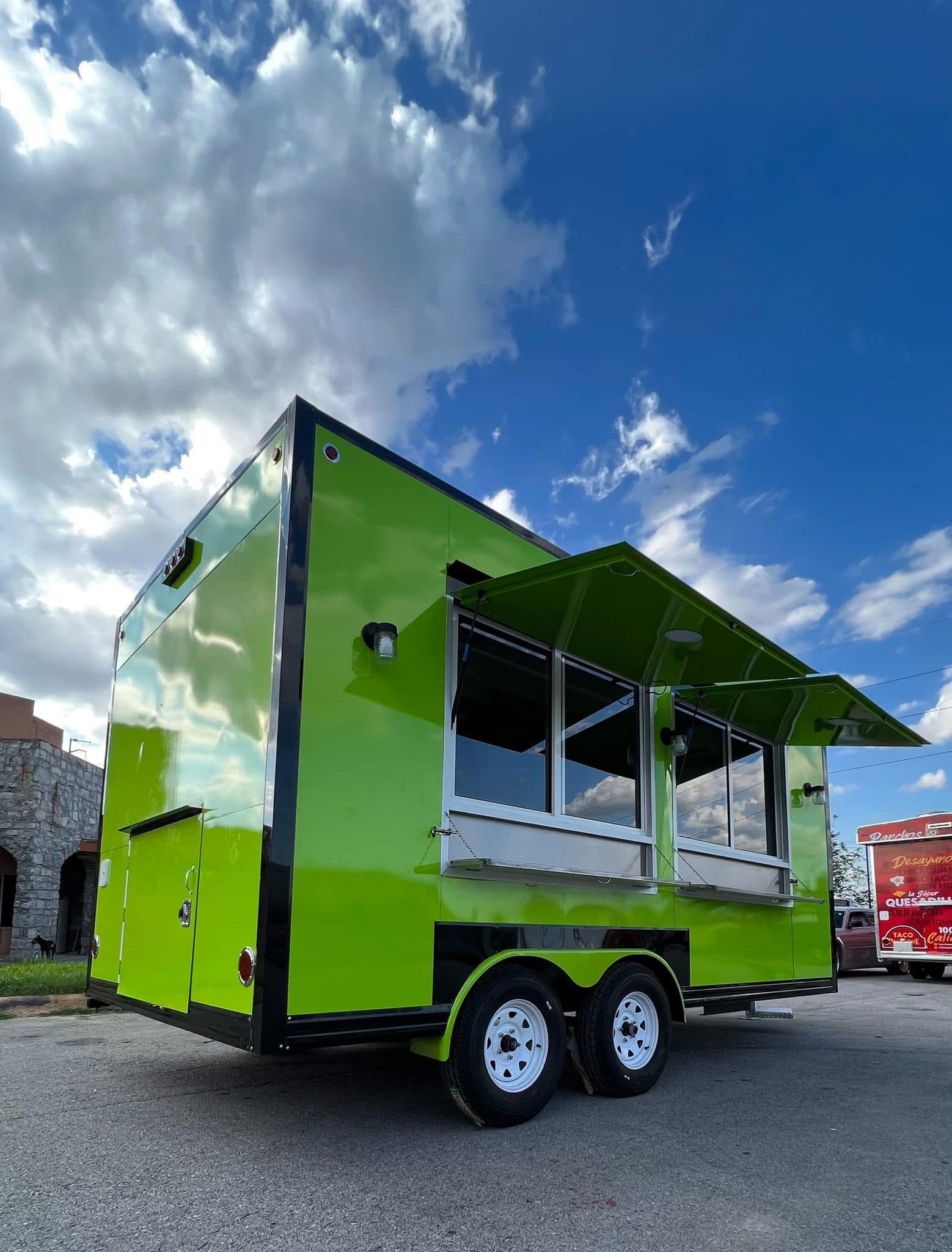 Green food trailer with awning open
